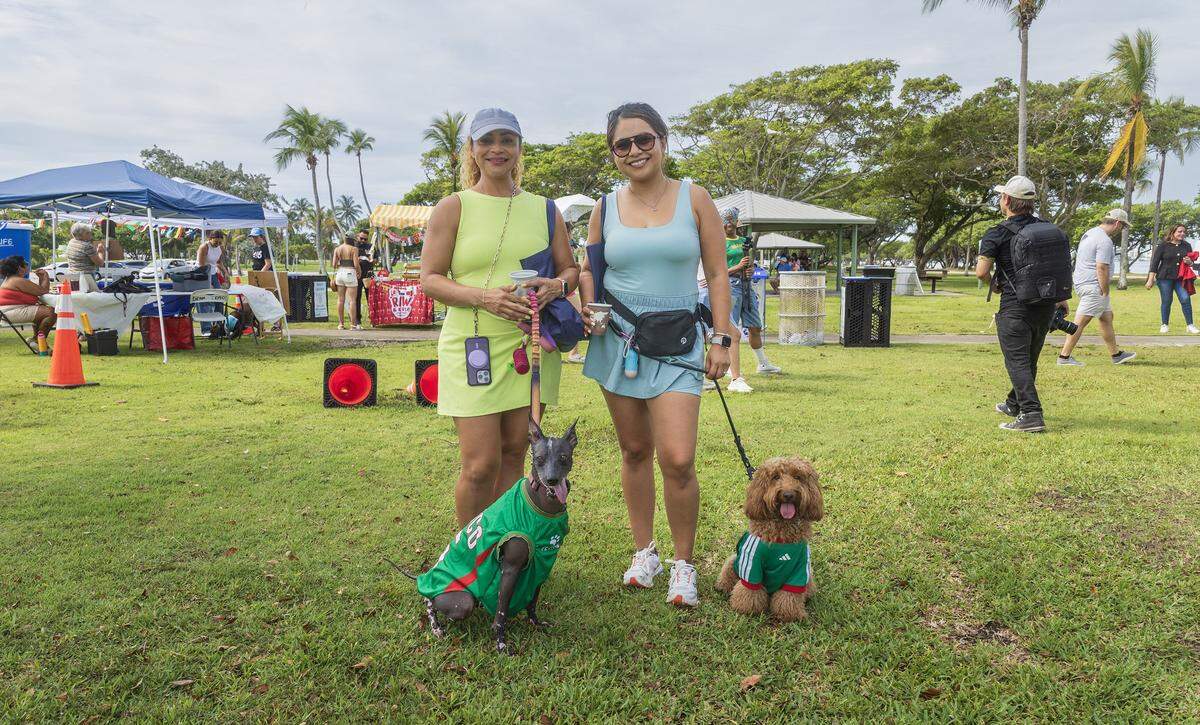 Nicte Ha (left) with her dog Cacao a Mexican hairless dog and Maria Melissa Rojas, with Chloe, a Golden Doodle, reprinting Mexico attended the “World Pup” for Miami's dogs and soccer fans, Inspired by the Super Bowl's Puppy Bowl and just in time for Miami's 2026 Soccer World Cup matches, hosted by Miami-Dade County & Debris Free Oceans, at Haulover Park on Saturday, May 30, 2026.
