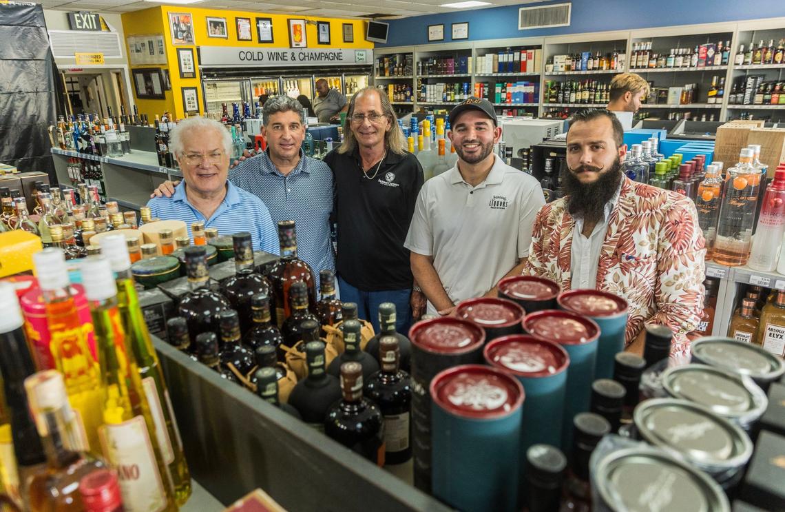 Sunset Corners’ former owners, cousins Michael Bittel (far left) and Larry Solomon (third from left), pose with new owner Eduardo Cruz and his son Kevin Cruz, with store manager Bruno Barbato (far right), at the landmark family business Sunset Corners located at 8701 Sunset Dr, in Miami, on Saturday, June 1, 2024. The store is now called Jensen’s at Sunset Corners.