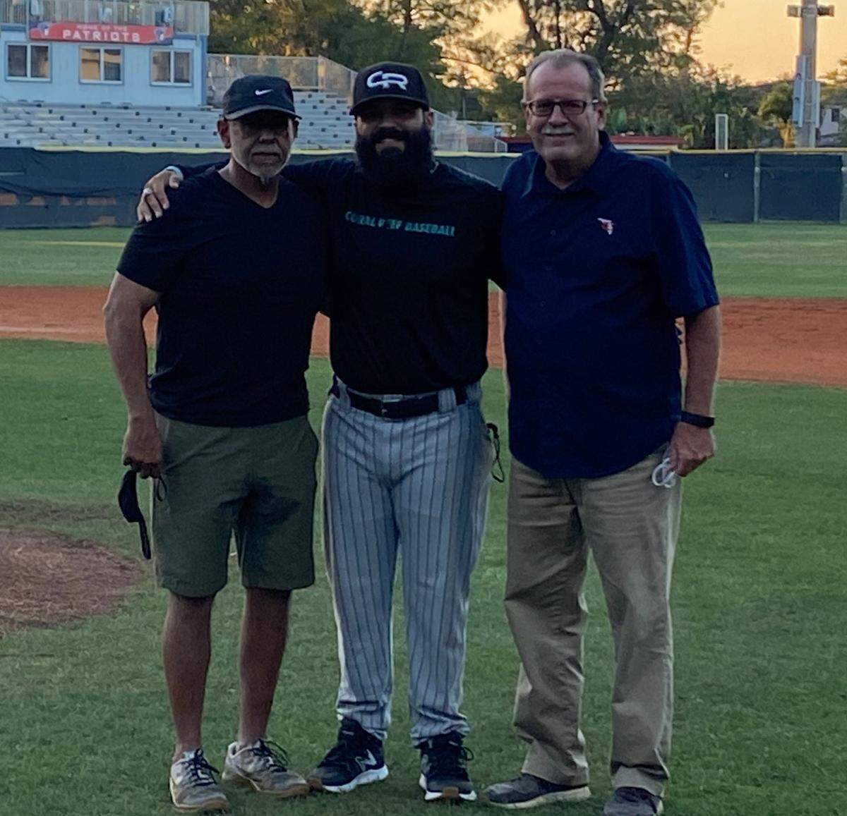 Chris Leon (middle) with ex-Florida Christian coach Ernie Padron (left) and Athletic director Ed Riggan (right).
