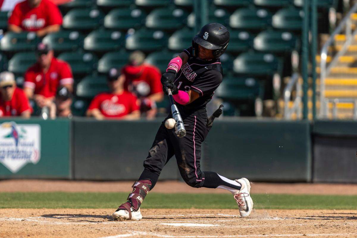 Marjory Stoneman Douglas batter Alex Rodriguez (13) hits the pitch for an RBI during the FHSAA Class 7A semifinal state game against Vero Beach at Hammond Stadium on Friday, May 17, 2024, in Fort Myers, Fla.