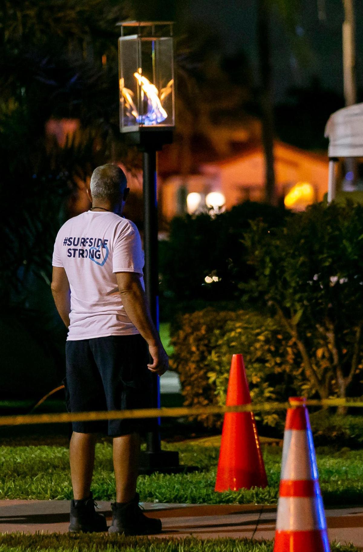 The Town of Surfside lit a torch near the site of the former Champlain Towers South condo building on Friday, June 24, 2022 in Surfside, Fla. Family members of the 98 victims of the June 24, 2021 condo collapse gathered at the site to mark the one year anniversary of the tragedy.