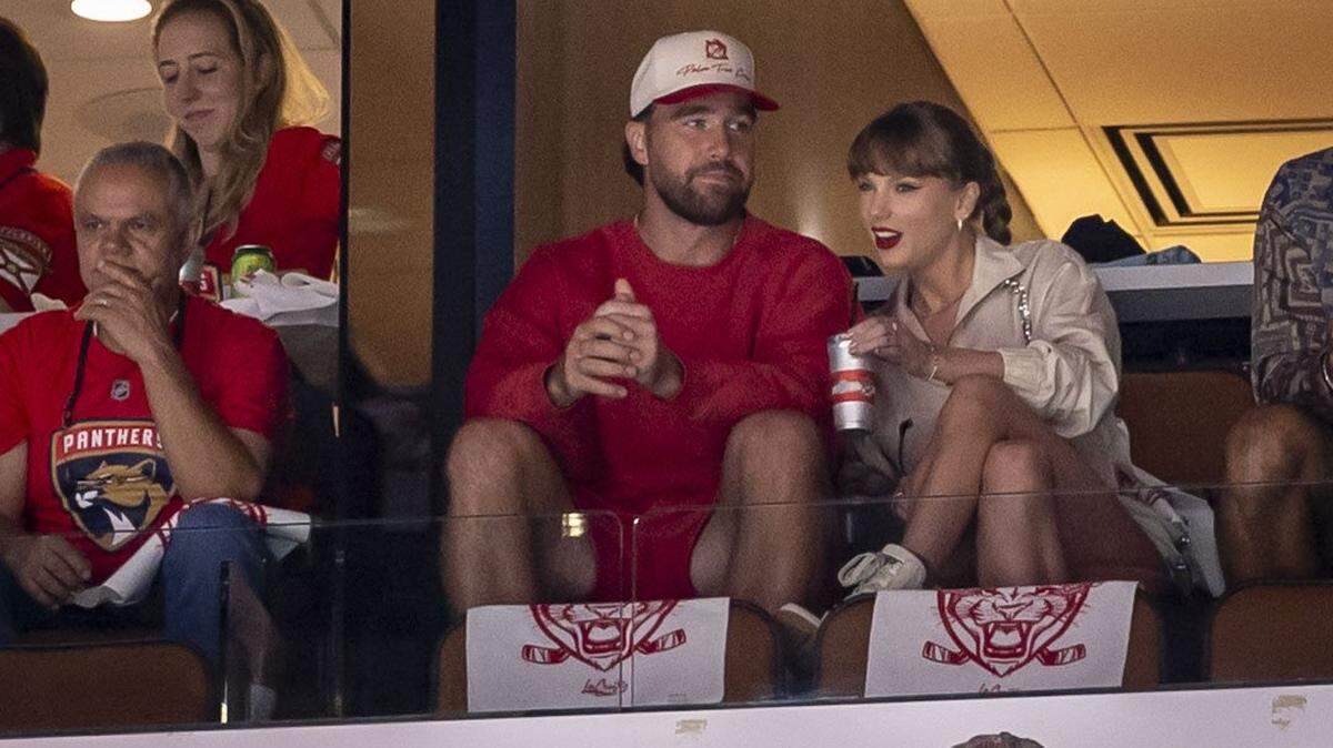 Travis Kelce and Taylor Swift enjoy the game between the Panthers and the Oilers during the first period of Game 4 in the NHL Stanley Cup Final series at Amerant Bank Arena on Thursday, June 12, 2025, in Sunrise, Fla.