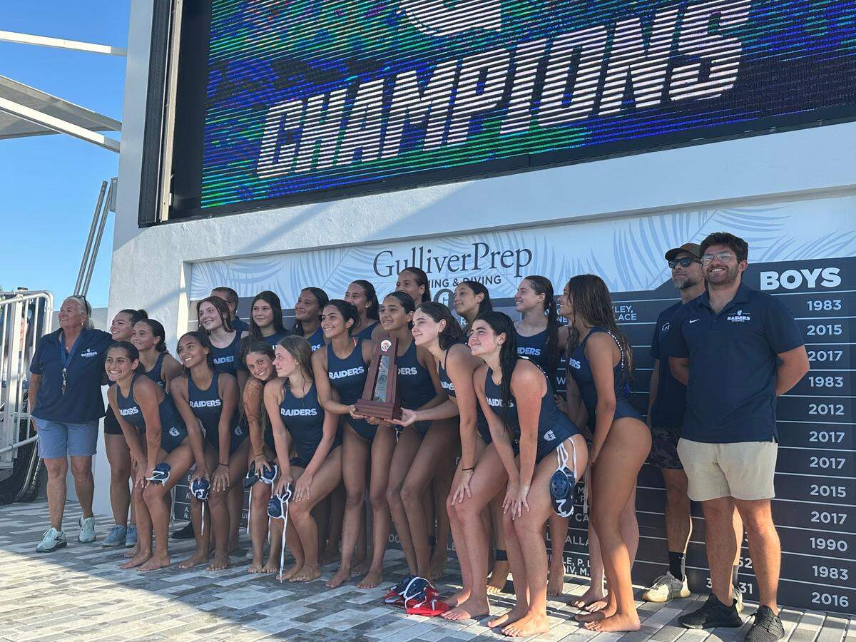 The Gulliver Prep girls’ water polo team celebrate after winning a regional championship on Thursday afternoon at its home pool following an 8-6 win over Ransom Everglades.