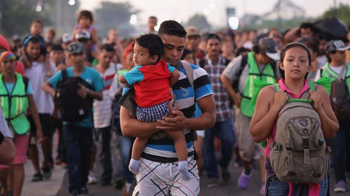 Migrants walk near Ciudad Hidalgo, Mexico, after crossing the Guatemalan border in October 2018.