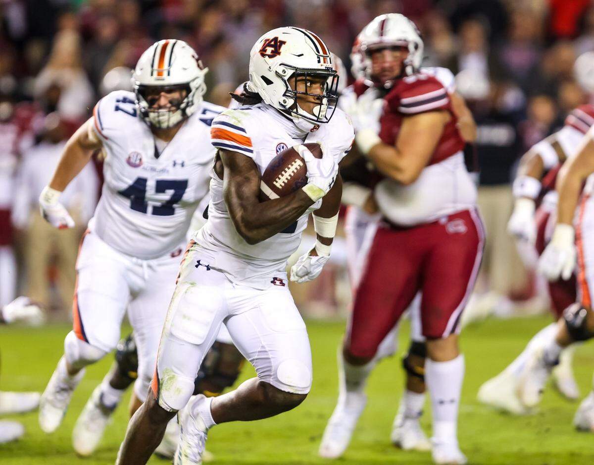 Nov 20, 2021; Columbia, South Carolina, USA; Auburn Tigers running back Tank Bigsby (4) rushes against the South Carolina Gamecocks in the second quarter at Williams-Brice Stadium. Mandatory Credit: Jeff Blake-USA TODAY Sports