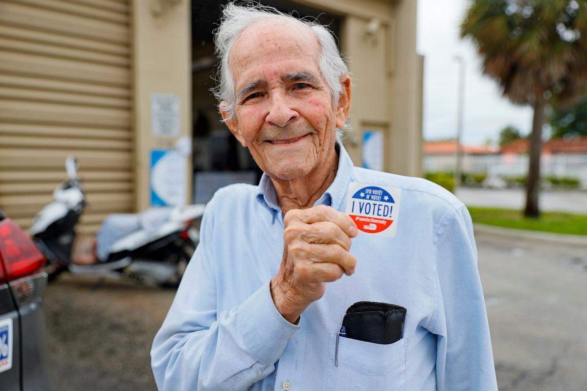 Hialeah resident Otto Fernandez, 93, flashes the “I Voted” sticker after casting a vote at the Hialeah Fire Station # 5 on Tuesday, Nov. 2, 2021.