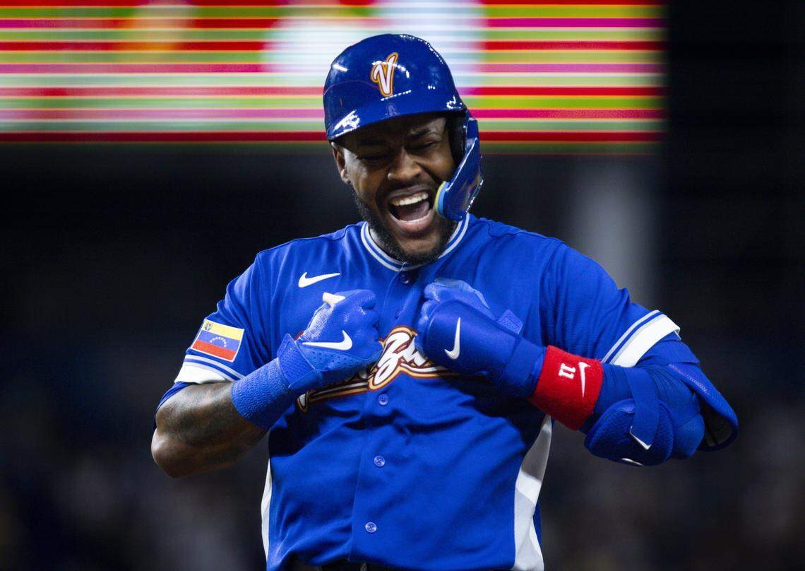 Venezuela third baseman Maikel Garcia (11) reacts after getting an RBI during the seventh inning of the World Baseball Classic semifinal against Italy on Monday, March 16, 2026, at loanDepot Park in Miami, Fla. 