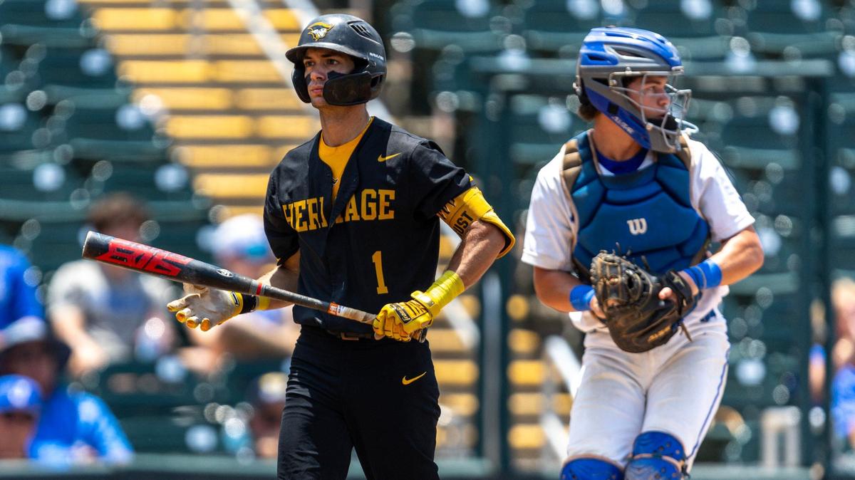 American Heritage batter Chris Levy (1) walks toward the dugout after striking out during first inning of the Class 5A state baseball championship game against Jesuit Tigers at Hammond Stadium on Saturday, May 18, 2024, in Fort Myers, Fla.