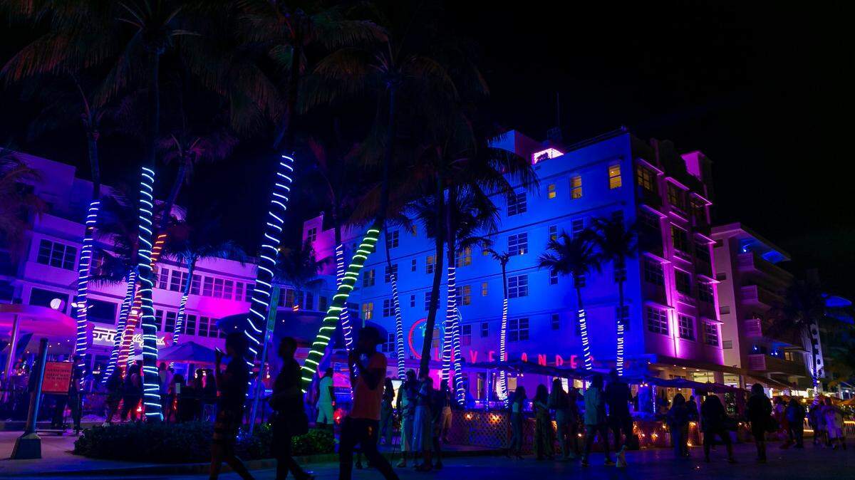 South Beach visitors make their way down Ocean Drive near the Clevelander in Miami Beach, Florida during the start of Memorial Day Weekend on Friday, May 28, 2021.