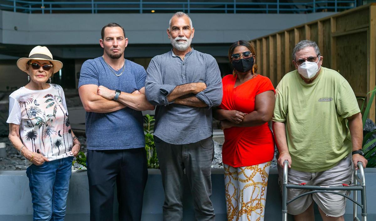 From left: Hamilton on the Bay residents Sandra Ross, Greg Frank, Osvaldo Perez, Gladezz McCoy and Larry Schatz at the apartment building on Tuesday, June 8, 2021. The attorney representing the Hamilton residents, said the owner is not being fair to its tenants by giving them such a short window of time to find a new place to live and move out.