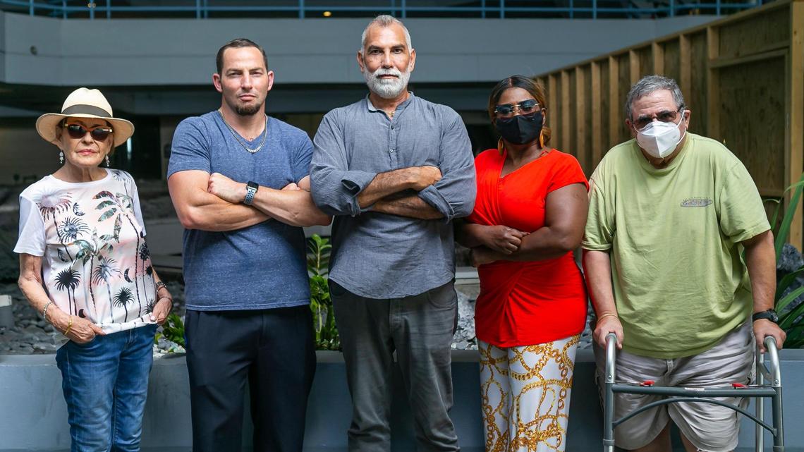 Residents of Hamilton on the Bay. Sandra Ross, far left, and Greg Frank, second left, spoke at a Miami City Commission meeting to ask for assistance from federal funds because they are unable to reach a settlement with their building’s owners.