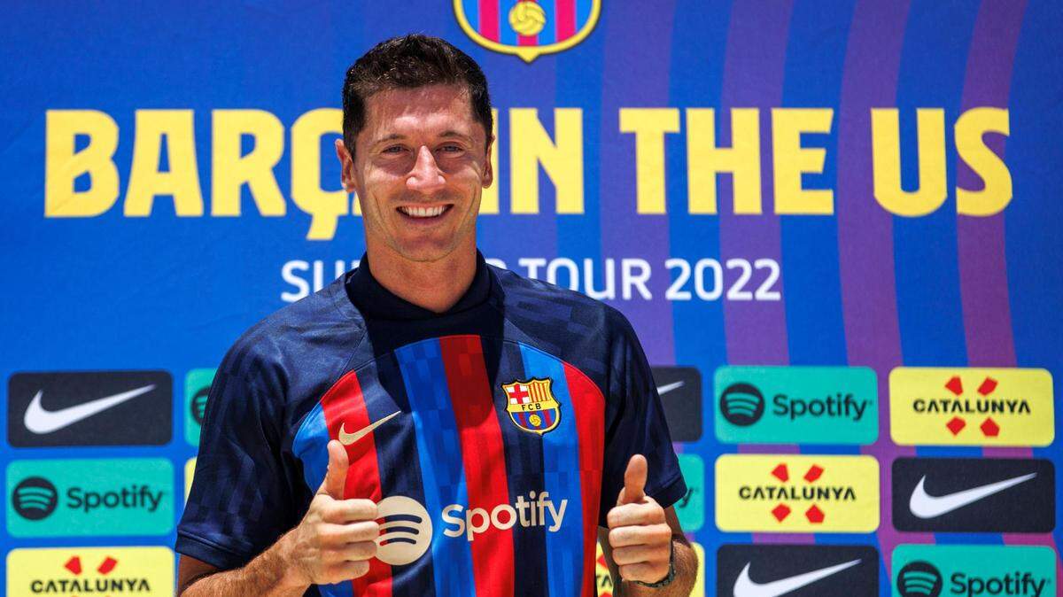 FC Barcelona new player Robert Lewandowski poses with his team jersey during press conference at the Conrad Fort Lauderdale Beach on Wednesday, July 20, 2022 in Fort Lauderdale, Florida.