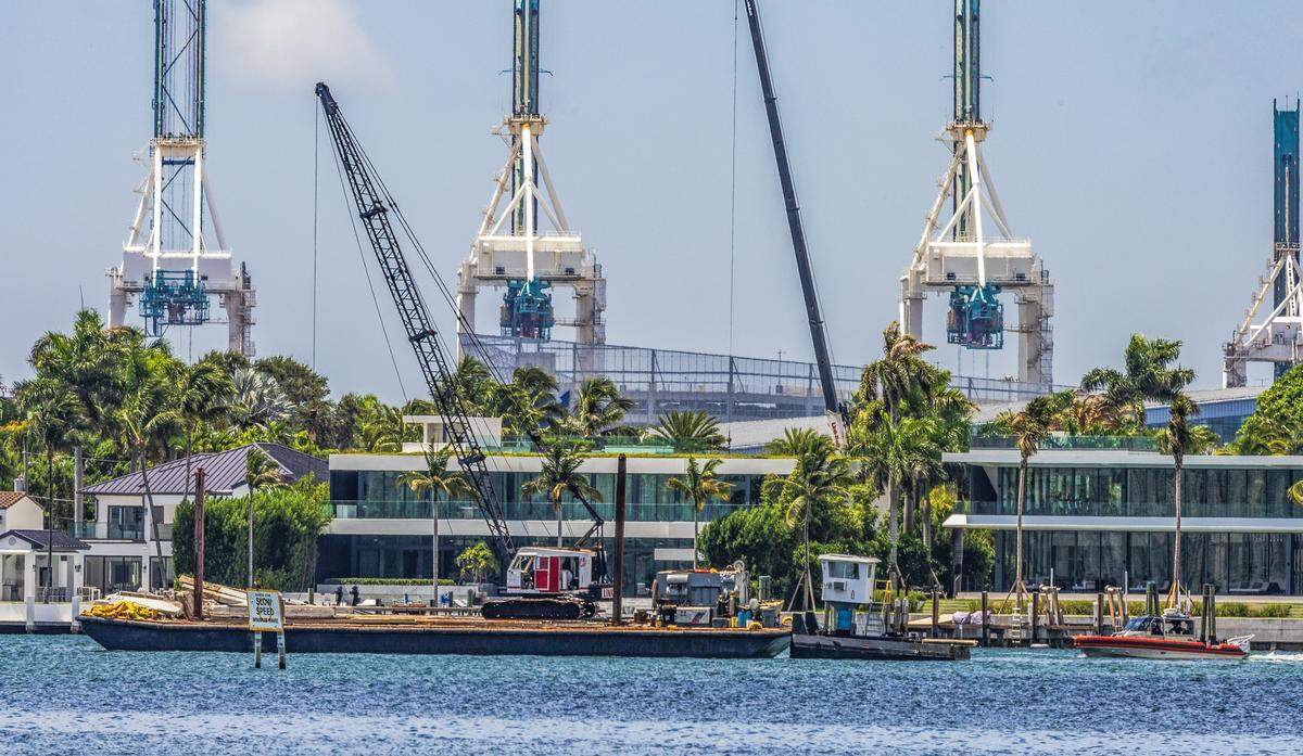 A U.S. Coast Guard vessel (far right) seen next to a barge that hit a sailboat that sank off Miami Beach’s Hibiscus Island in Biscayne Bay Monday morning, July 28, 2025. Five children and a camp counselor were aboard the sailboat, part of a Miami Yacht Club summer camp. Three girls died as a result of the crash. 