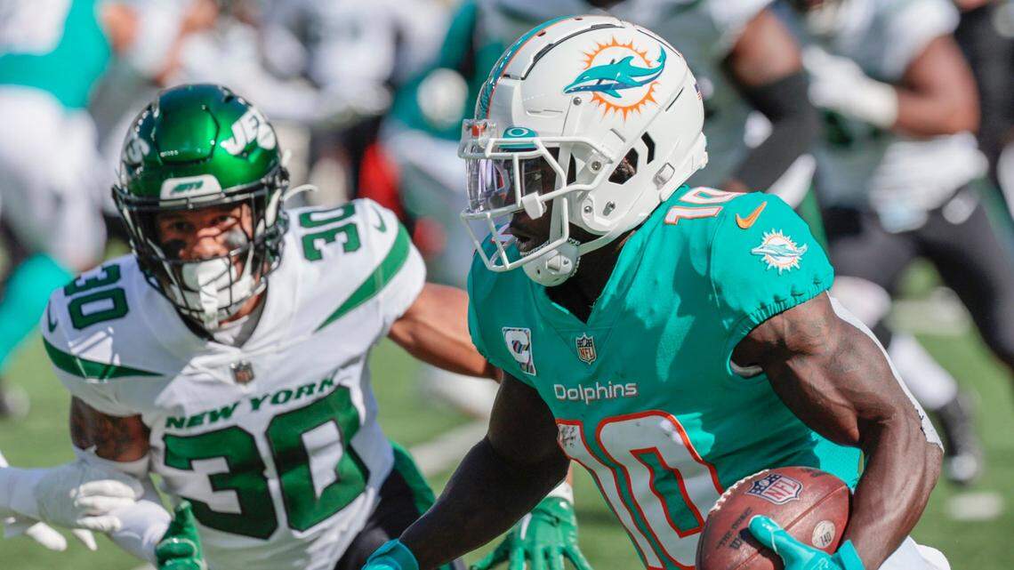 Miami Dolphins wide receiver Tyreek Hill (10) on a pass reception in the first half against the New York Jets at MetLife Stadium in in East Rutherford, New Jersey on Sunday, October 9, 2022.