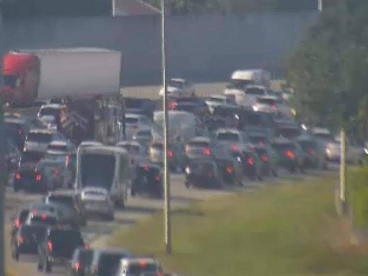 Slow traffic creeps along the northbound lanes of the Florida Turnpike near Kendall Drive on Friday evening, May 24, 2024, due to an overturned tanker truck.