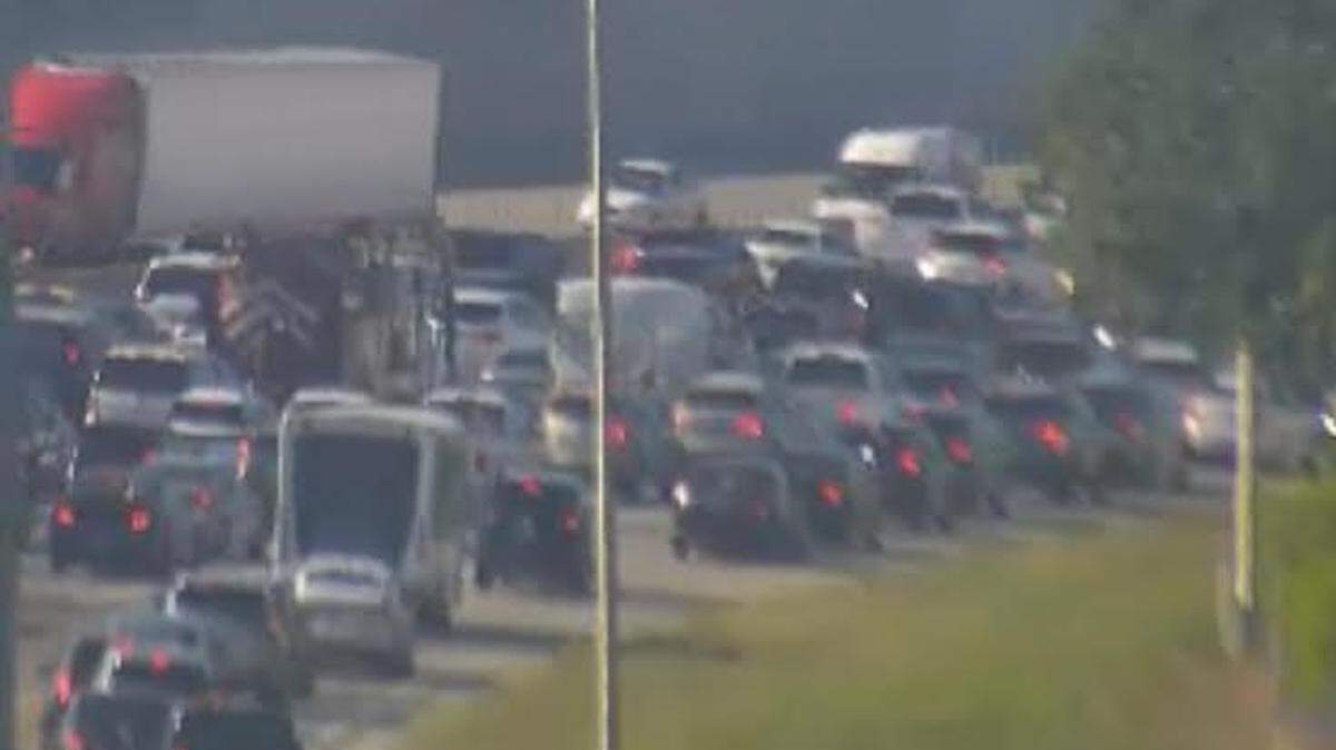 Slow traffic creeps along the northbound lanes of the Florida Turnpike near Kendall Drive on Friday evening, May 24, 2024, due to an overturned tanker truck.