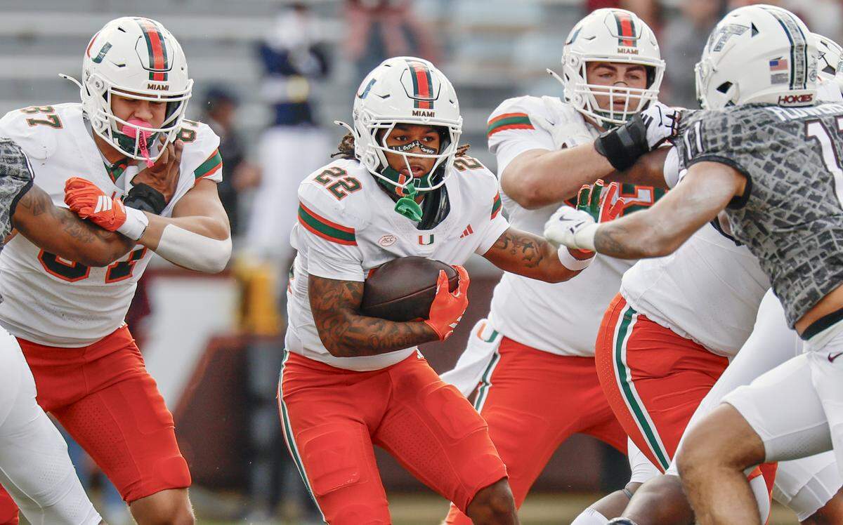 Miami Hurricanes running back Girard Pringle Jr. (22) on a carry in the first half against the Virginia Tech Hokies at Lane Stadium in Blacksburg, Virginia, on Saturday, November 22, 2025.