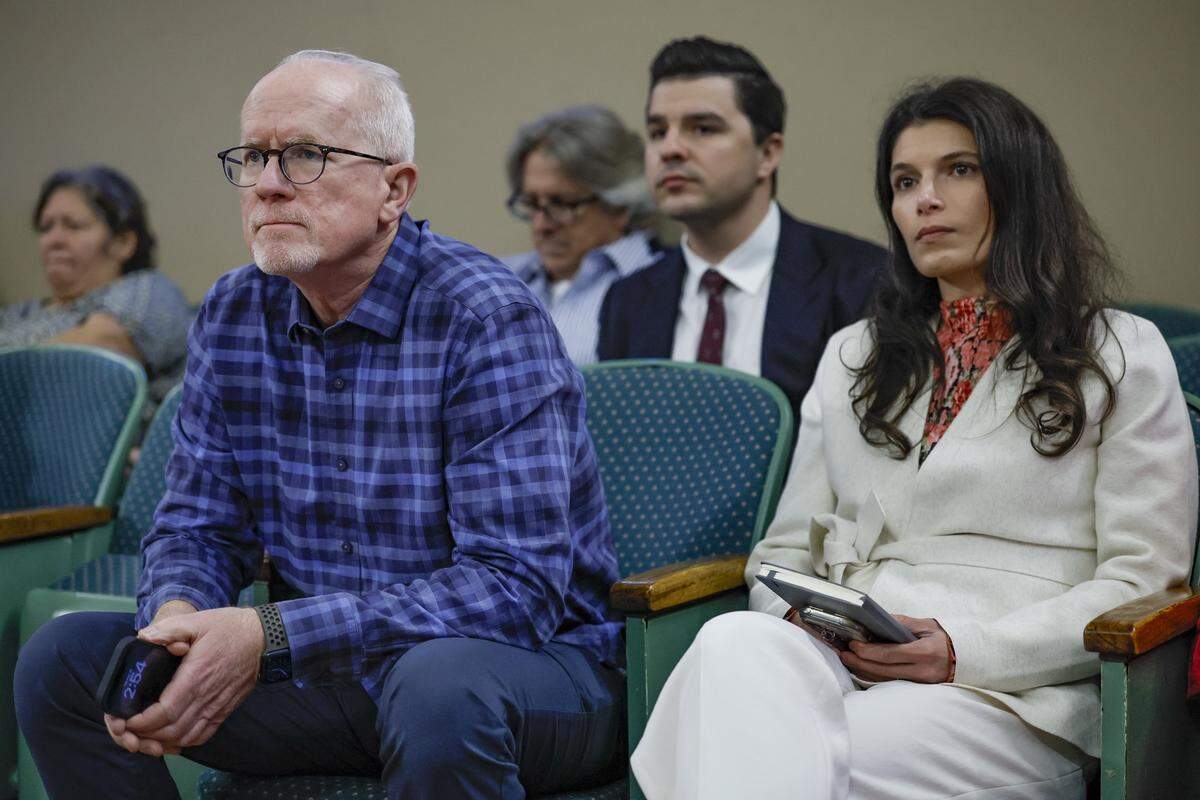 Fifield Real Estate Developer's Chief Operating Officer Kevin Farrell and Vice President for Development Sarina Sorrentino listen during the commission meeting on development plans at 110 Phoenetia Ave at the site of the "Garden of Our Lord" and an ancient tree that is believed to be at least as the century old City of Coral Gables, Florida on Tuesday, February 10, 2026.