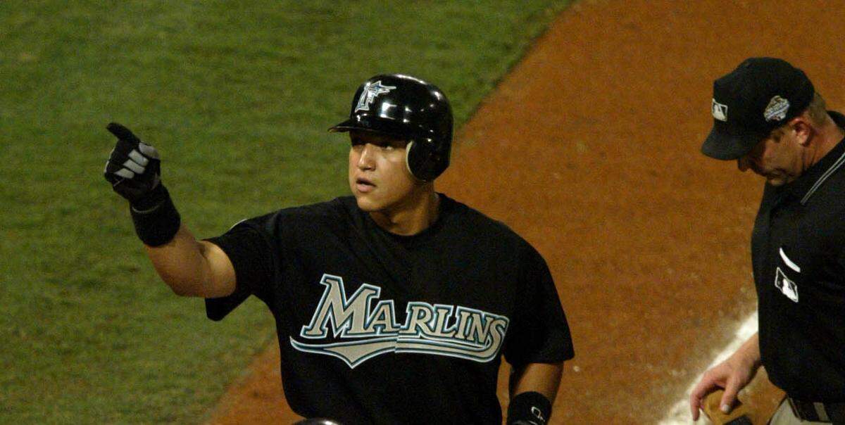 In this Oct. 22, 2003 file photo, Miguel Cabrera points to the crowd after his first-inning home run drives in Pudge Rodriguez in Game 4 of the World Series against the New York Yankees at Pro Player Stadium.