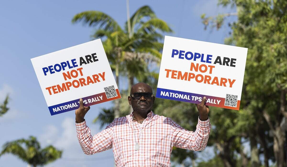 Marc Nenejeudy attends a rally at the Little Haiti Cultural Center on Thursday, July 9, 2026, in Miami, Fla. The event called for protections for Temporary Protected Status (TPS) holders and other immigrants after the Trump administration stripped many of them of legal protections against deportation.