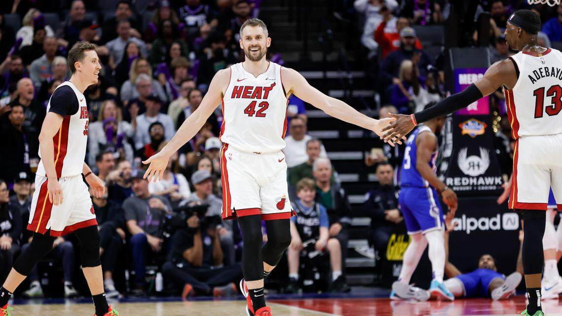 Miami Heat forward Kevin Love (42) celebrates with center Bam Adebayo (13) during the third quarter against the Sacramento Kings at Golden 1 Center.