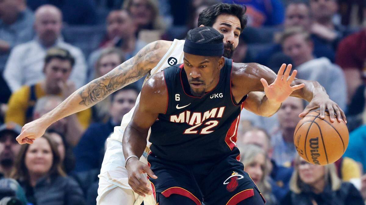 Miami Heat forward Jimmy Butler (22) plays against Cleveland Cavaliers guard Ricky Rubio during the first half of an NBA basketball game, Tuesday, Jan. 31, 2023, in Cleveland.