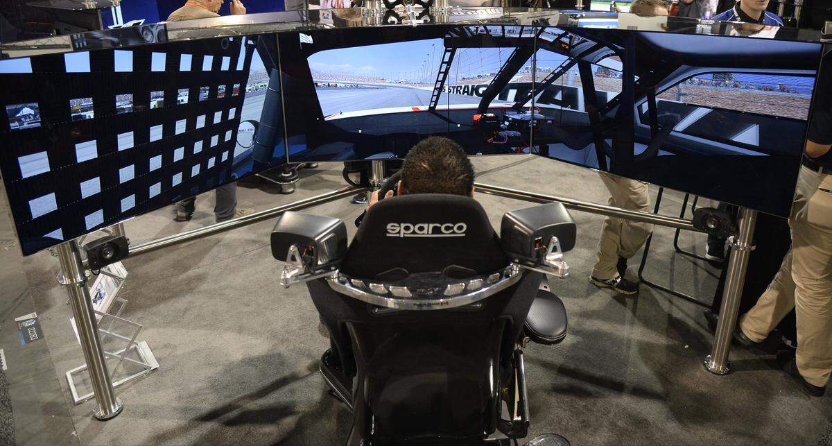 iRacing gaming, which its developers say gives the full effect of racing NASCAR, is seen on display during the first day of the 2014 SEAM show on Nov. 4, 2014 in Las Vegas, Nev. (Gene Blevins/LA DAILY NEWS/Zuma Press/TNS)