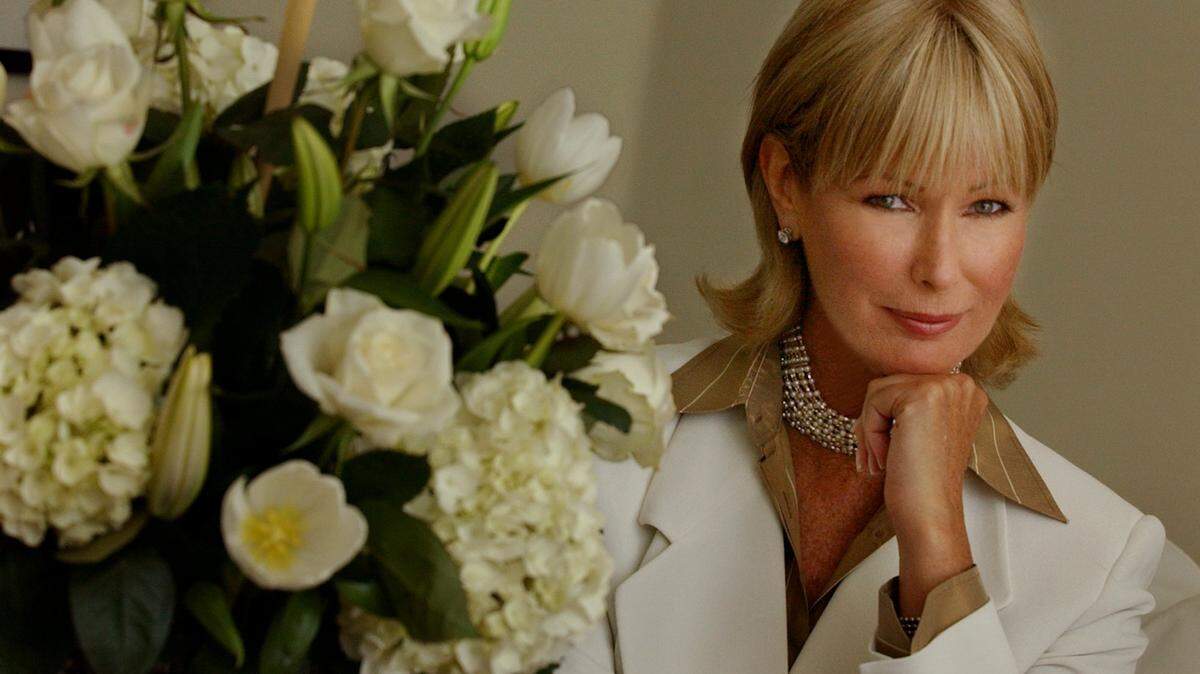 In this file photo from Jan. 9, 2004, Former "Virginia Slims Girl" model and business woman Michele Pommier sits in the living room of her South Beach condo.