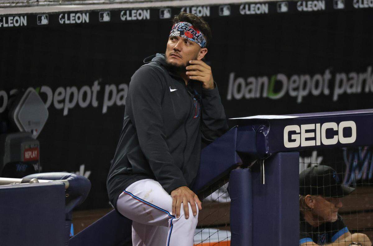 Miami Marlins shortstop Miguel Rojas (19) looks from the dugout during the eighth inning of their baseball game against the Colorado Rockies at loanDepot park on Wednesday, June 9, 2021 in Miami, Florida.