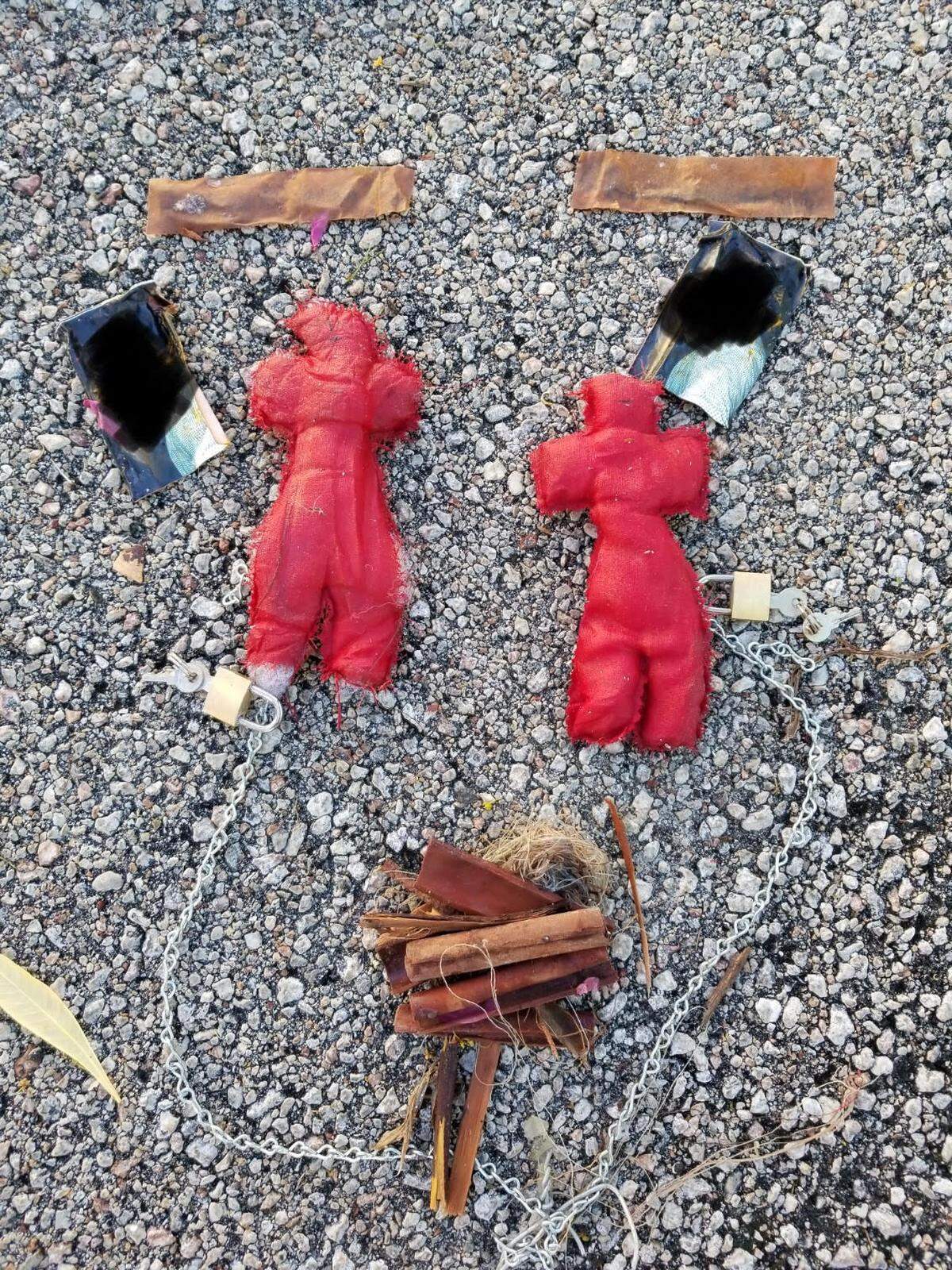 The turtles were chained to a bag containing two red rag dolls, two photographs and cinnamon sticks.