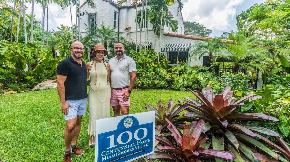 Owners Russ Colombo (far left) and Alain Carrazana, with designer Lissandra Castillo of 21 design + construction, posed in front of Colombo and Carrazana’s designated historic home built in 1925 by architect Marion Manley. The city is celebrating its architectural residential gems at a time when many historic houses in Miami-Dade County face demolition at the hands of new or existing owners, on Saturday May 11, 2024.