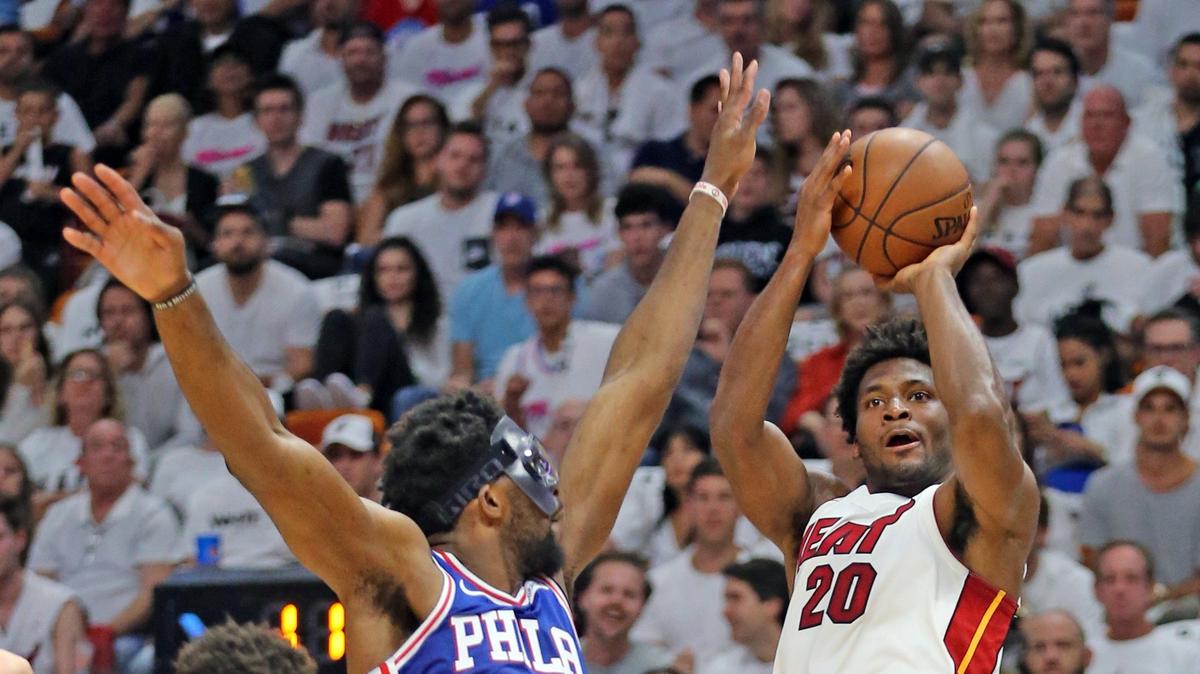 Miami Heat forward Justise Winslow shoots from the corner as Philadelphia 76ers center Joel Embiid defends him in Game 3 of their playoff series in April.