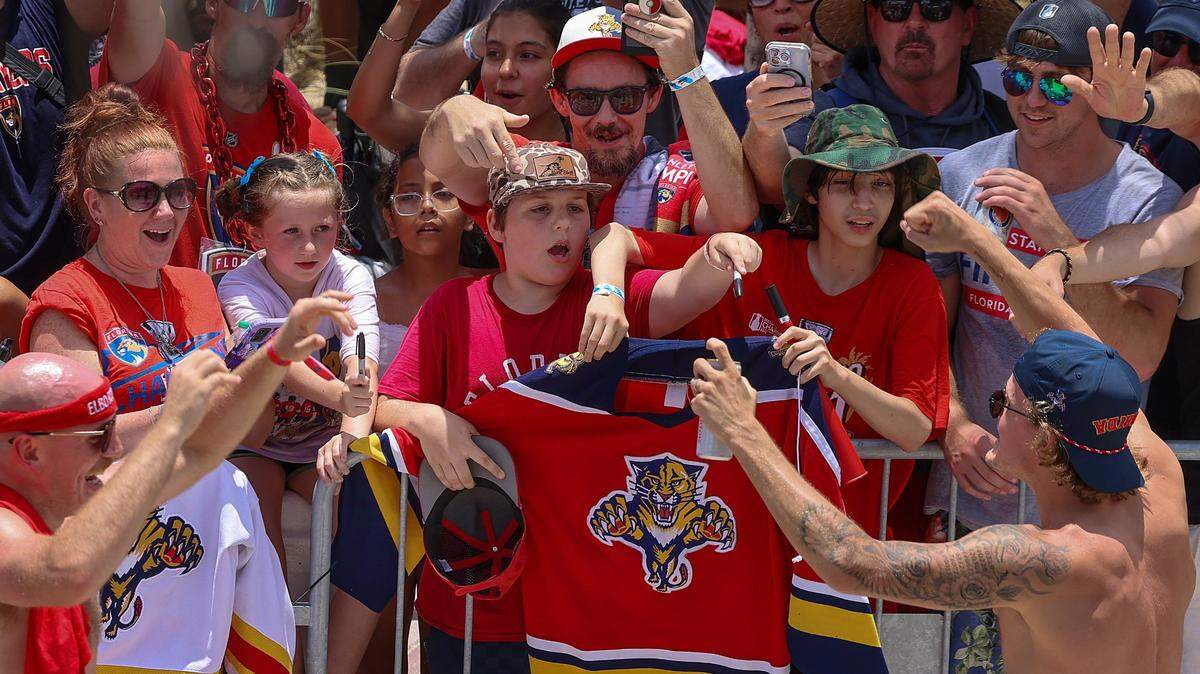 Panthers player greets fans on A1A just north of the staging area for the Florida Panthers Stanley Cup championship celebration parade on Sunday, June 22, 2025 in Fort Lauderdale, Florida.