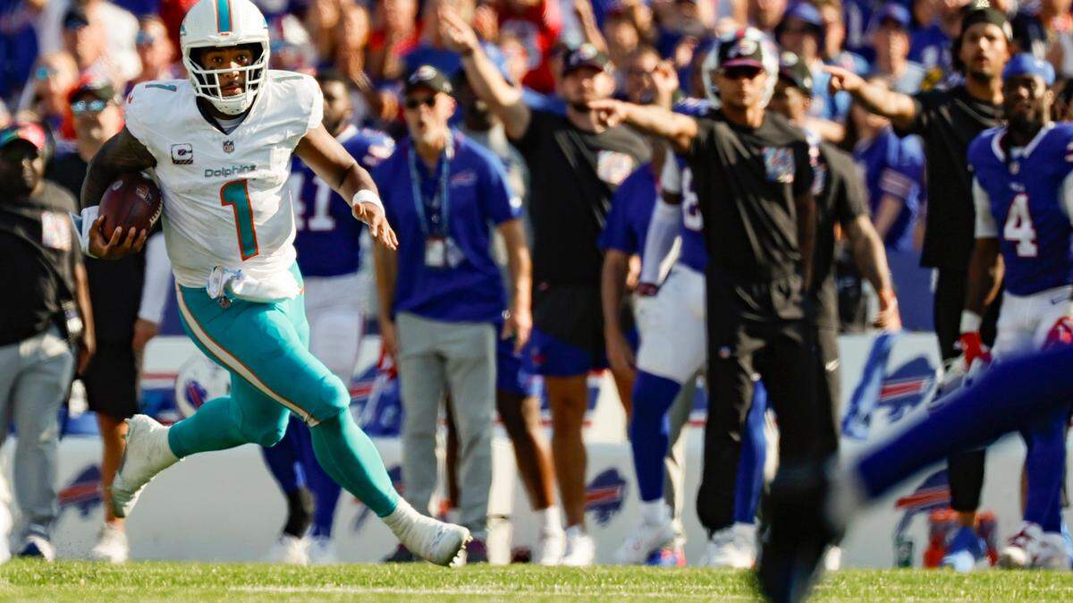 The Buffalo sideline reacts as Miami Dolphins quarterback Tua Tagovailoa (1) scrambles across the line of scrimmage in the second half against the Buffalo Bills at Highmark Stadium in Orchard Park, NY., on Sunday, October 1, 2023.