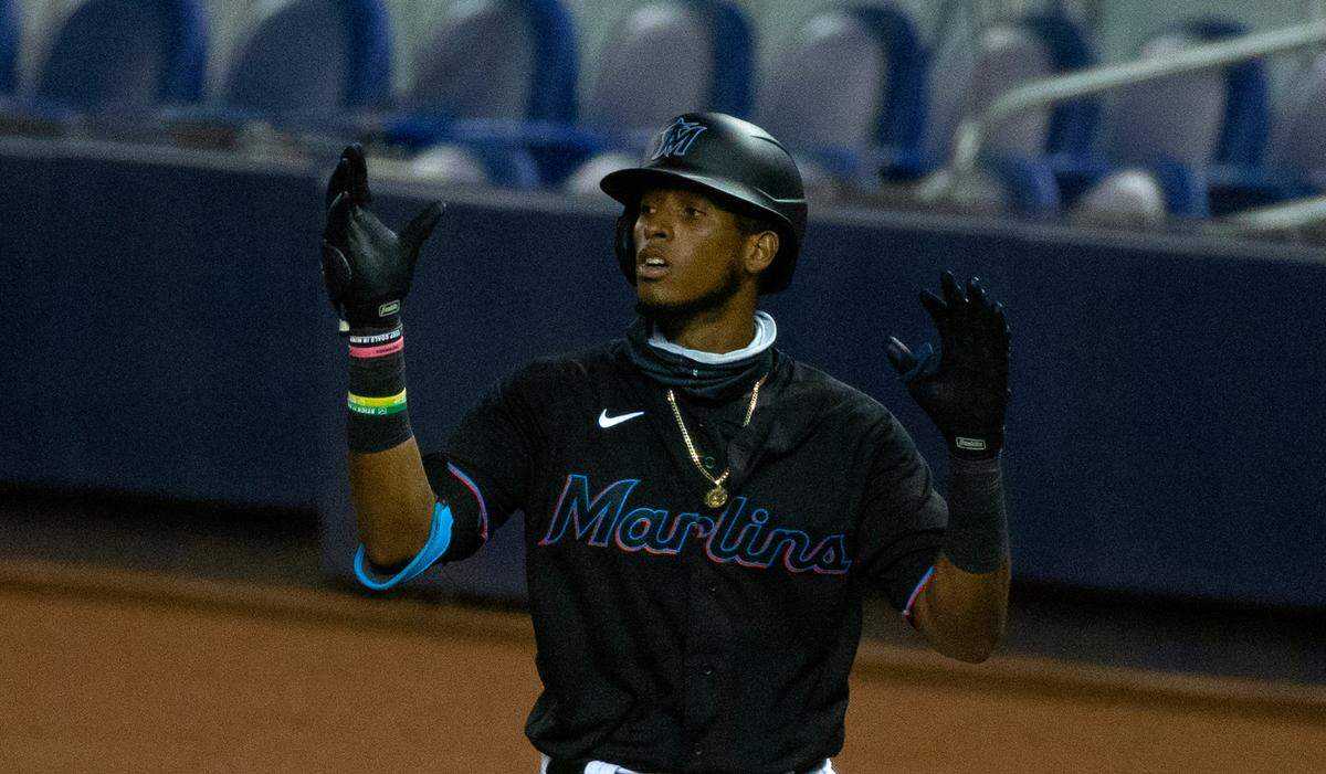 Miami Marlins infielder Lewin Diaz (68) reacts after hitting a single during the ninth inning of a Major League Baseball game against the Atlanta Braves at Marlins Park in Miami on Saturday, August 15, 2020.