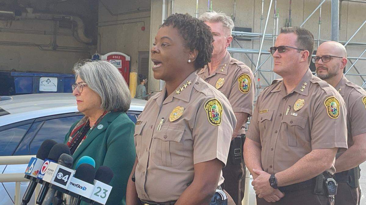 Miami-Dade Police Director Stephanie Daniels, with county Mayor Daniella Levine Cava by her side, speaks to reporters outside of Jackson Memorial Hospital Monday, Nov. 20, 2023, to discuss the condition of an officer who was shot earlier in the day.