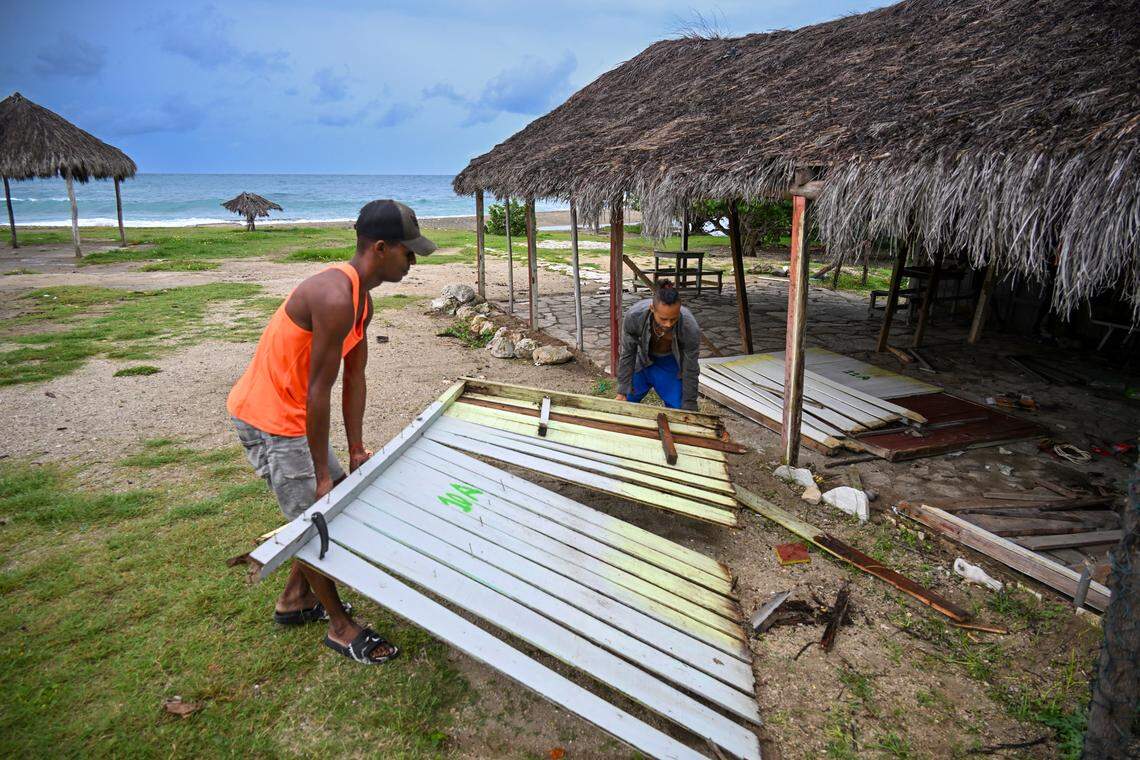 Worker dismantle parts of a tourist facility at Guama beach ahead of the arrival of Hurricane Melissa near Santiago de Cuba, Cuba, on October 28, 2025. 