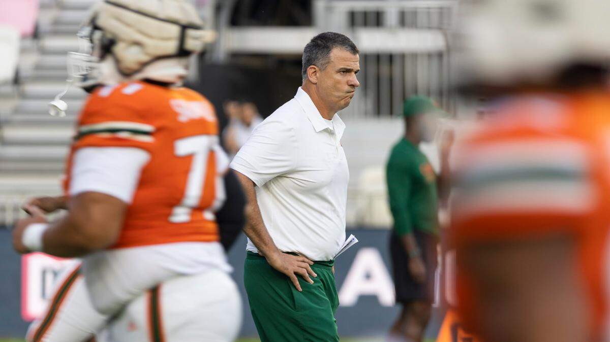 Miami Hurricanes head coach Mario Cristobal watches his team run warmup session before the start of a spring game at DRV PNK Stadium on Friday, April 14, 2023, in Fort Lauderdale, Fla.