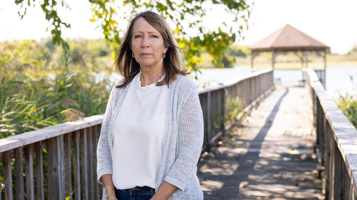 Deborah Buttgereit poses near her daughter’s home in Hampton, Virginia. Buttgereit struggled to afford health coverage after her husband’s death and was uninsured when she slipped on some ice in Montana and broke her arm. The surgery bill was nearly $98,000, well above the initial estimate the hospital provided.
