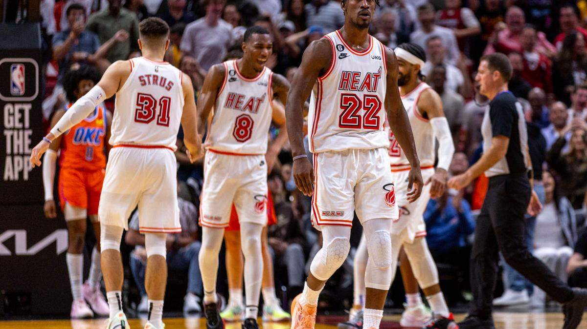 Miami Heat forward Jimmy Butler (22) reacts along with teammates after scoring late in the fourth quarter to put his team ahead during an NBA game against the Oklahoma Thunder at FTX Arena in Downtown Miami, Florida, on Tuesday, January 10, 2023.
