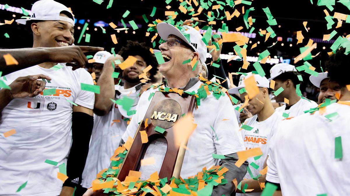 Miami head coach Jim Larrañaga celebrates with his team after defeating Texas 88-81 in an Elite 8 college basketball game in the Midwest Regional of the NCAA Tournament, Sunday, March 26, 2023, in Kansas City.