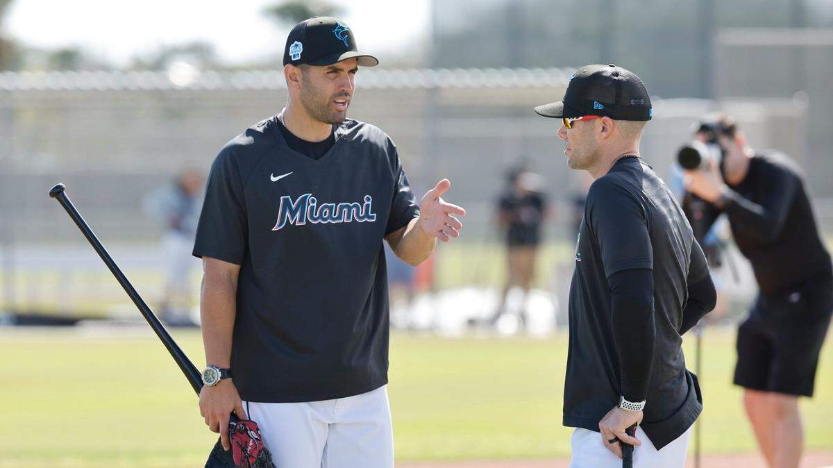 Miami Marlins manager Skip Schumaker (right) talks with bench coach Luis Urueta at Roger Dean Chevrolet Stadium in Jupiter, Florida on Thursday, February 16, 2023.