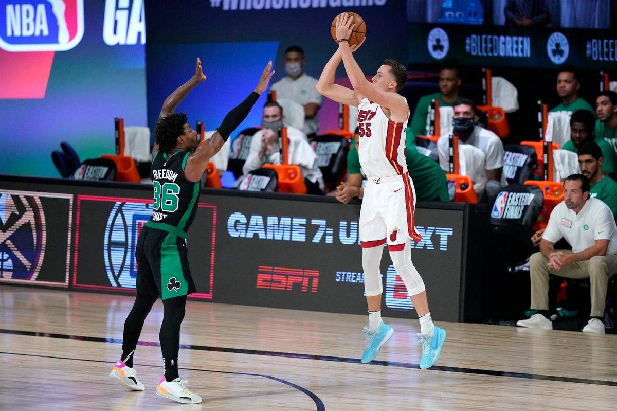 Boston Celtics’ Marcus Smart (36) defends against a shot by Miami Heat’s Duncan Robinson (55) during the second half of an NBA conference final playoff basketball game, Tuesday, Sept. 15, 2020, in Lake Buena Vista.