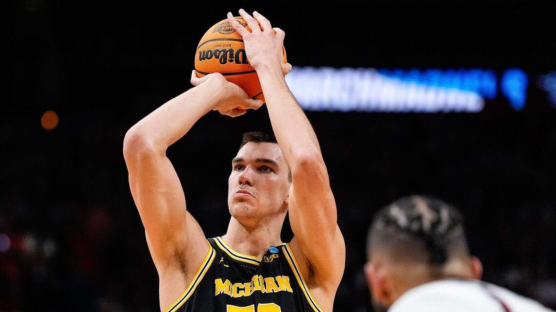 Michigan center Vladislav Goldin (50) attempts a free throw against Auburn during the second half of the Sweet 16 round of NCAA tournament at State Farm Arena in Atlanta on March 28, 2025.