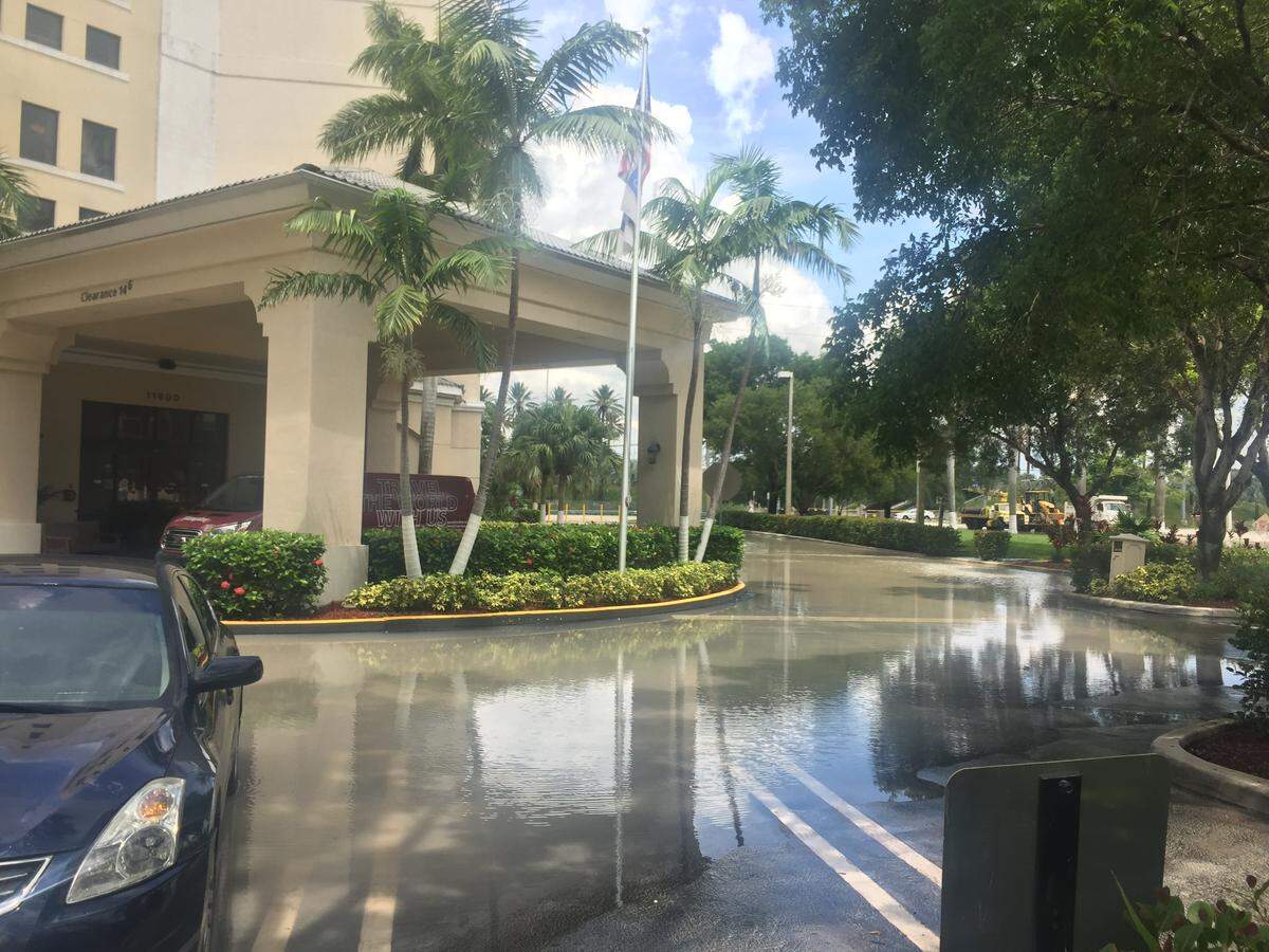 Water pools up in front of the entrance to Hampton Inn and Suites on Tuesday afternoon.