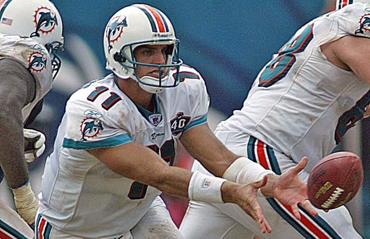 Gus Frerotte pitches to Ronnie Brown as the Dolphins play the Denver Broncos at Dolphins Stadium in Miami on Sept. 11, 2005.