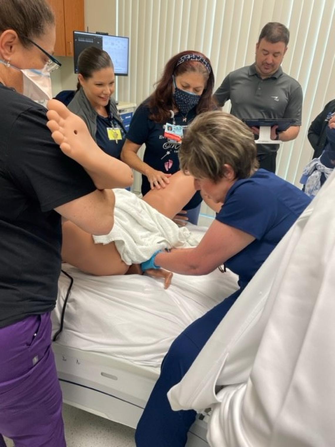 Students in the nursing fellowship program at Memorial Healthcare System observe a simulation of a breech birth. Started in August 2021 to combat the growing nursing shortage, the year-long program prepares nurses to work in specialty areas through class instruction, hands-on coaching and simulation training.
