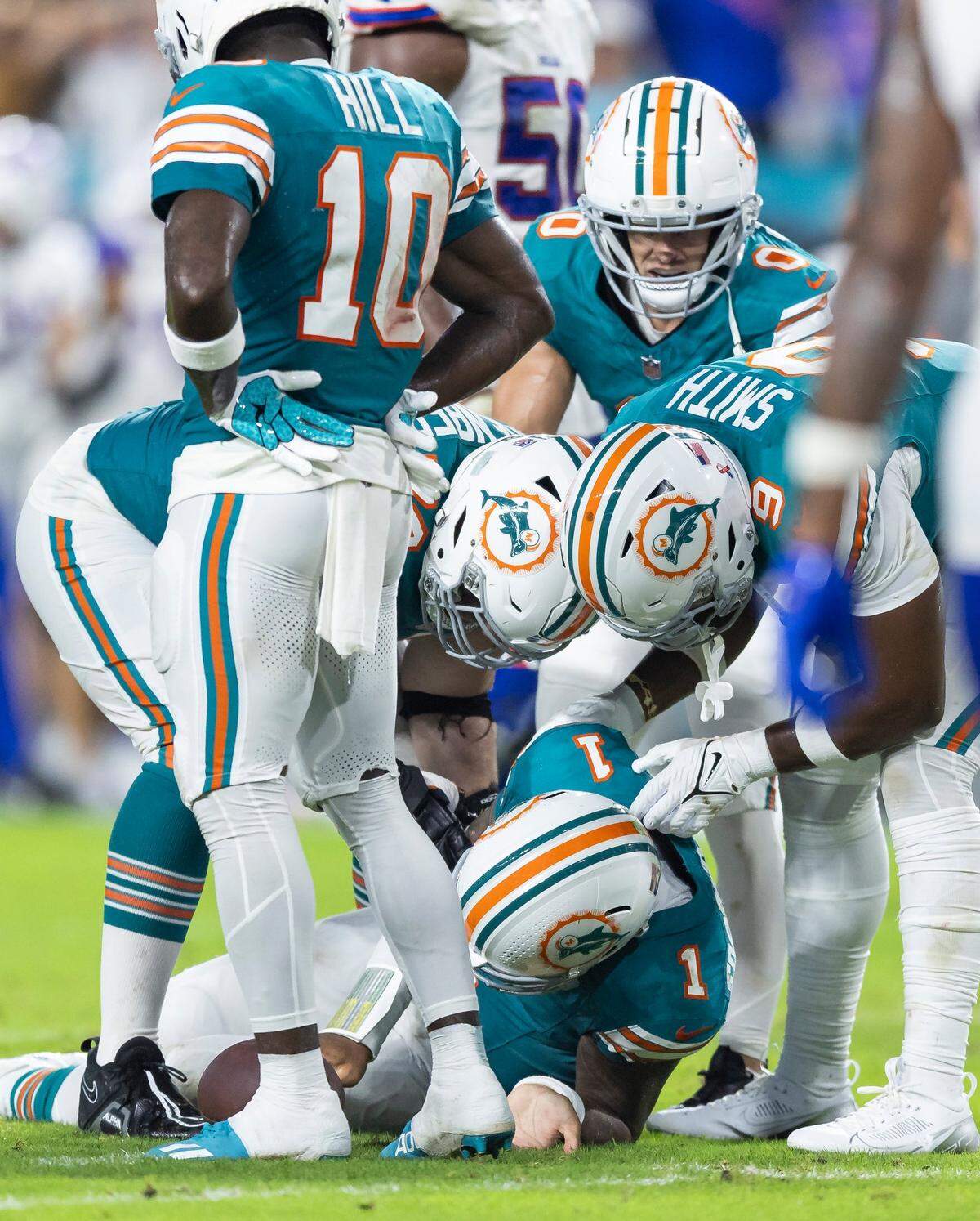 Miami Dolphins quarterback Tua Tagovailoa (1) suffers a concussion after a play against the Buffalo Bills in the second half of their NFL game at Hard Rock Stadium on Thursday, Sept. 12, 2024, in Miami Gardens, Fla.