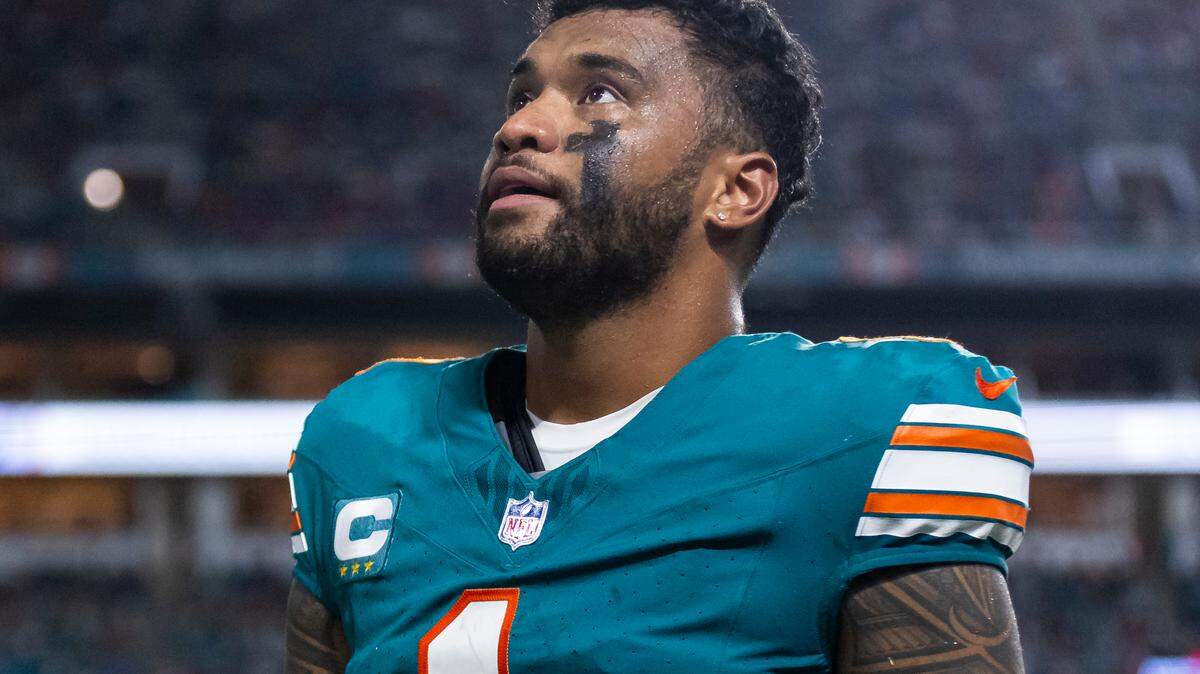 Miami Dolphins quarterback Tua Tagovailoa (1) walks off the field after suffering a concussion in a play against the Buffalo Bills in the second half of their NFL game at Hard Rock Stadium on Thursday, Sept. 12, 2024, in Miami Gardens, Fla.