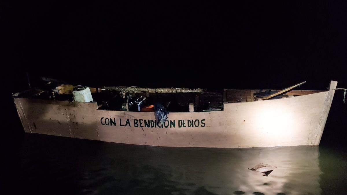 A rustic boat carrying 15 people from Cuba landed ashore in the Florida Keys on Dec. 25, 2022, according to the U.S. Border Patrol. 